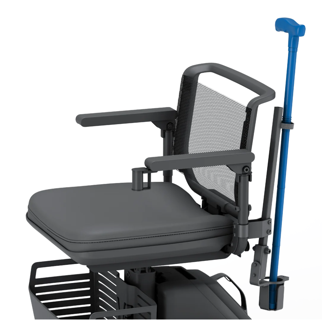 The Cane Holder for WHILL Model R Scooters securely holds a blue cane upright at the back of the seat, which features armrests, a mesh backrest, and a storage basket below—a practical accessory for mobility and convenience.